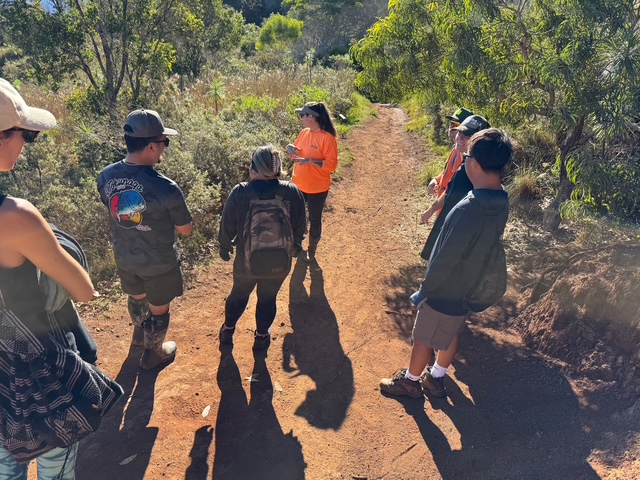 employee from KISC sharing information about native plants along iliau trail 